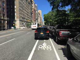 car obstructing bike lane